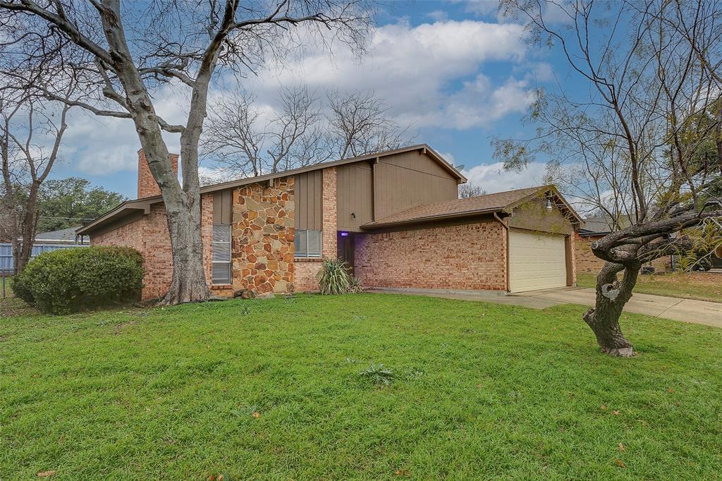 1024 Edgewood Trail Benbrook, TX 76126 - Photo 3 of 28 a view of a backyard with potted plants and large tree