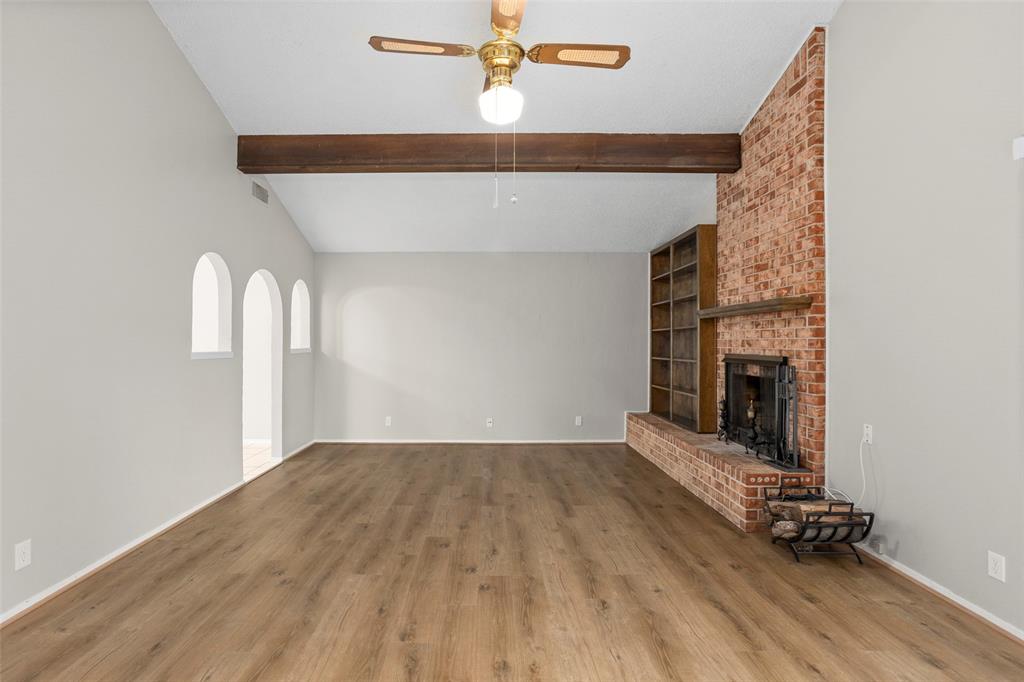 1024 Edgewood Trail Benbrook, TX 76126 - Photo 5 of 28 wooden floor in an empty room with a fireplace