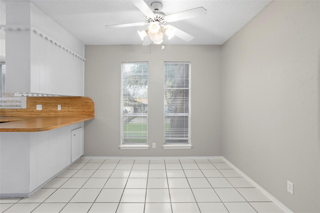 1024 Edgewood Trail Benbrook, TX 76126 - Photo 10 of 28 a view of an empty room with window and cabinet