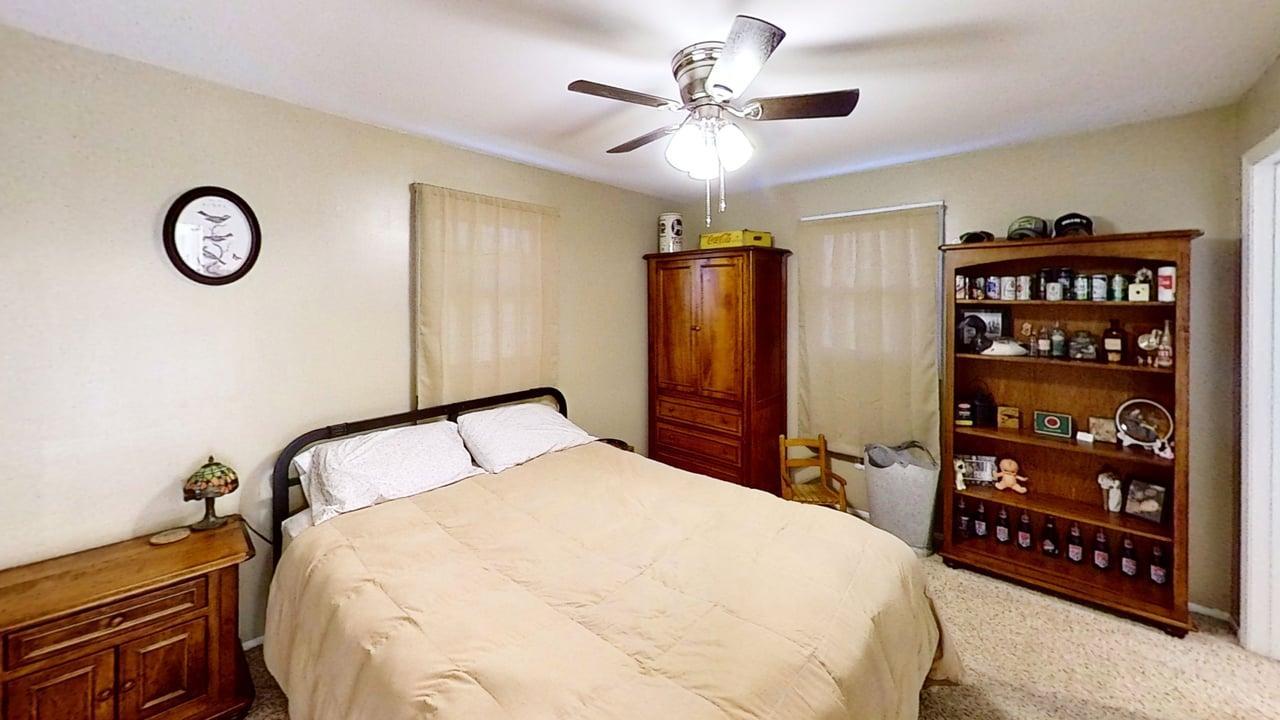 17 Greenlawn Drive Kankakee, IL 60901 - Photo 17 of 29 a bedroom with a large bed and a chandelier