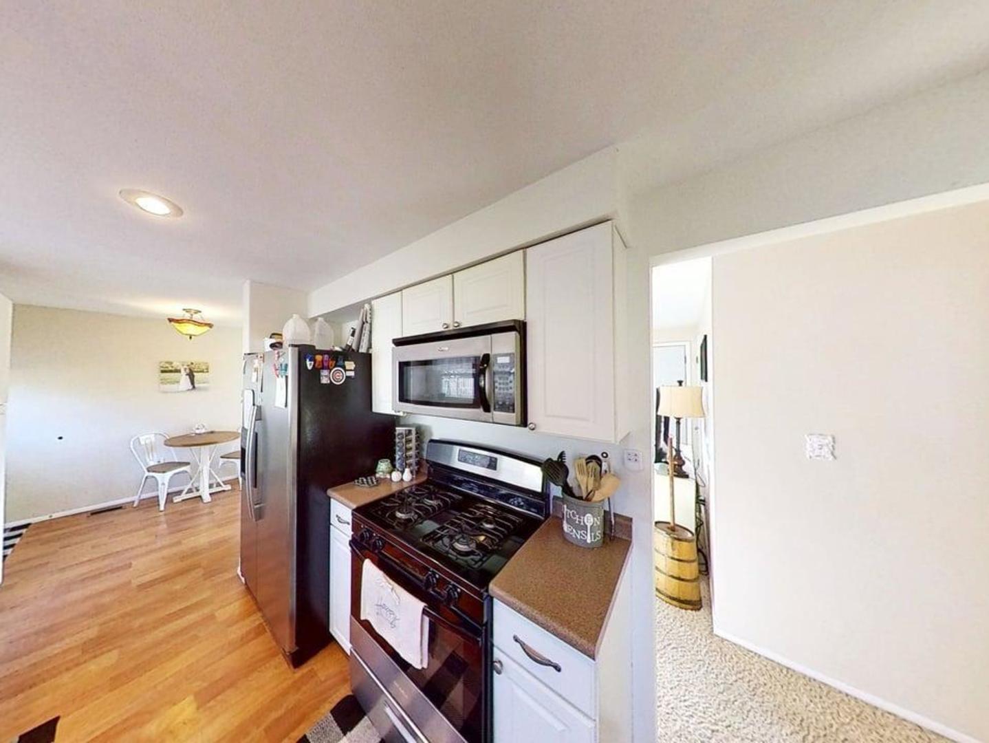 17 Greenlawn Drive Kankakee, IL 60901 - Photo 10 of 29 a kitchen with stainless steel appliances granite countertop a stove and a refrigerator