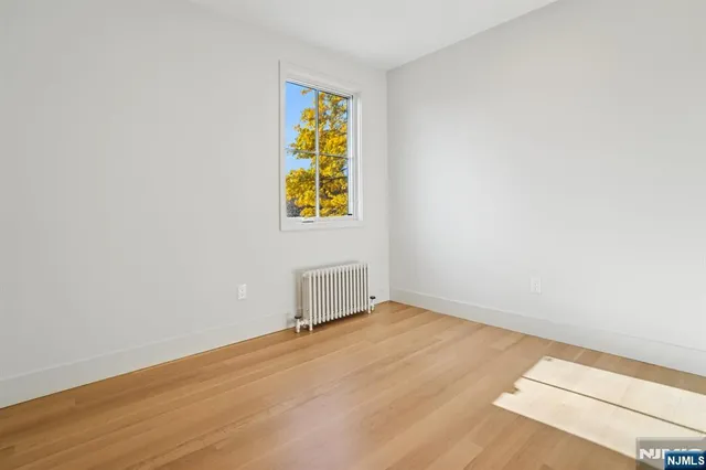 a bedroom with a bed and a chair