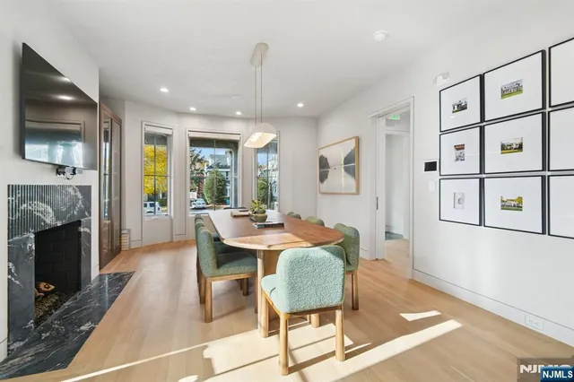 a dining room with furniture and window