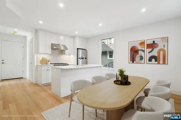 a living room with furniture and kitchen view
