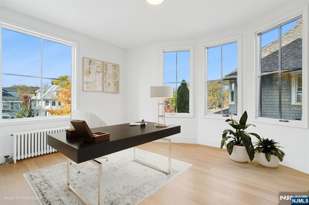 75 Midland Avenue Montclair, NJ 07042 - Photo 23 of 26 a living room with furniture and wooden floor