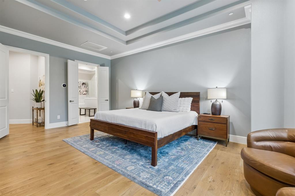 6700 Herbert Road Colleyville, TX 76034 - Photo 6 of 32 a bedroom with a bed and wooden floor