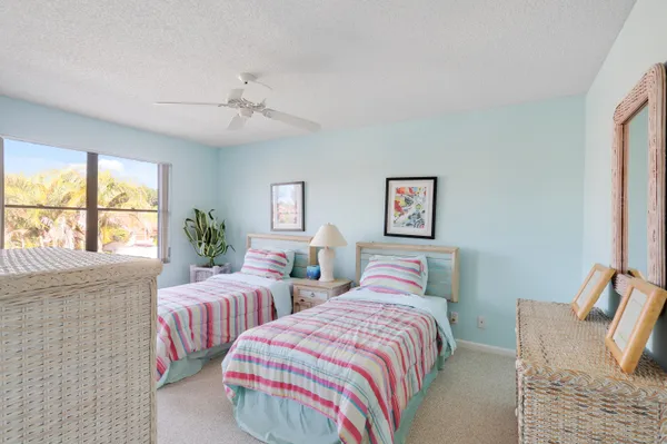 a bathroom with a shower a toilet and a sink
