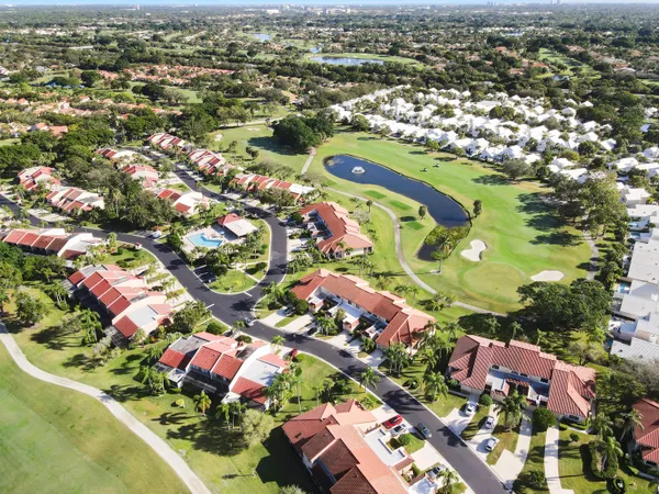 an aerial view of residential houses with outdoor space