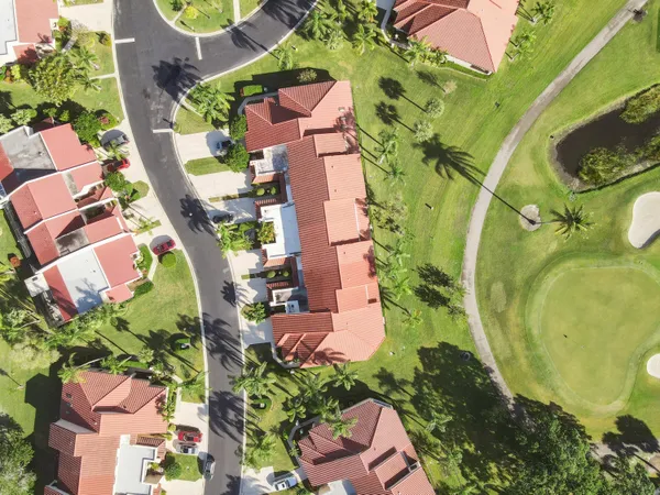 an aerial view of residential houses with outdoor space