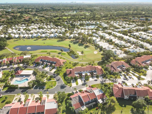 an aerial view of residential houses with outdoor space