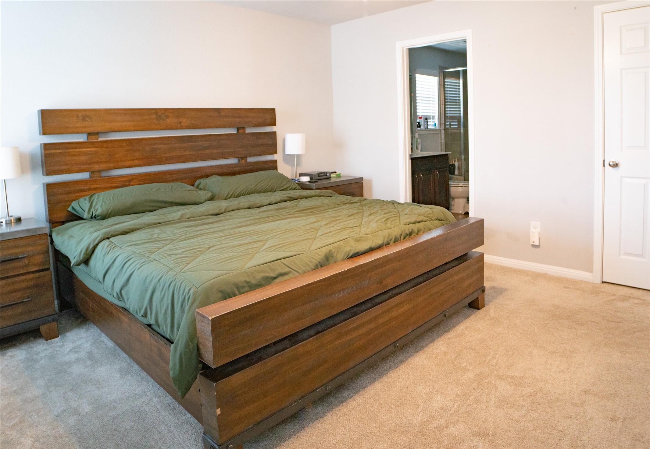 160 Shearwater Lane Leander, TX 78641 - Photo 20 of 24 a bed sitting in a bedroom next to a window