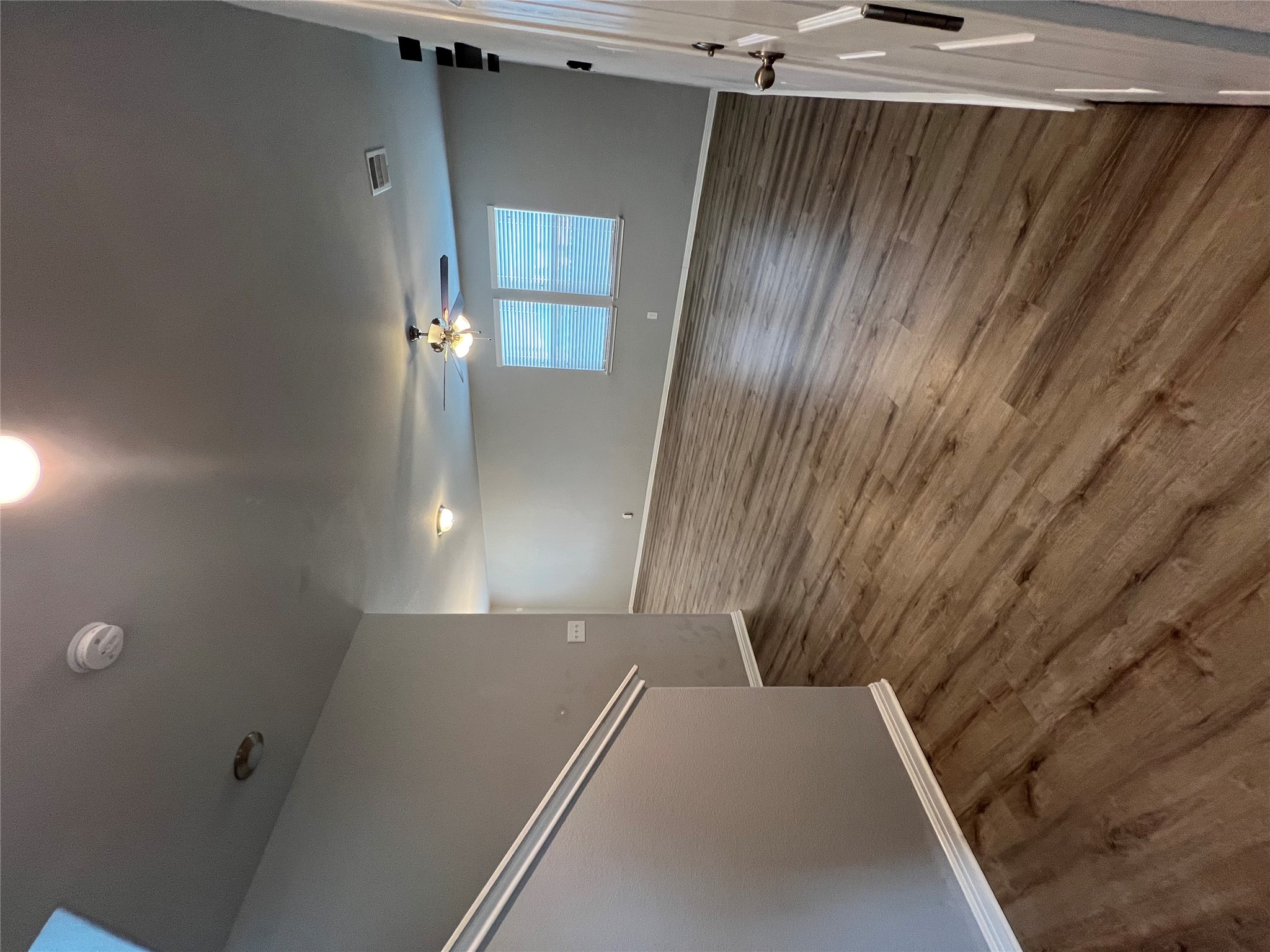 160 Shearwater Lane Leander, TX 78641 - Photo 3 of 24 an empty room with wooden floor and windows