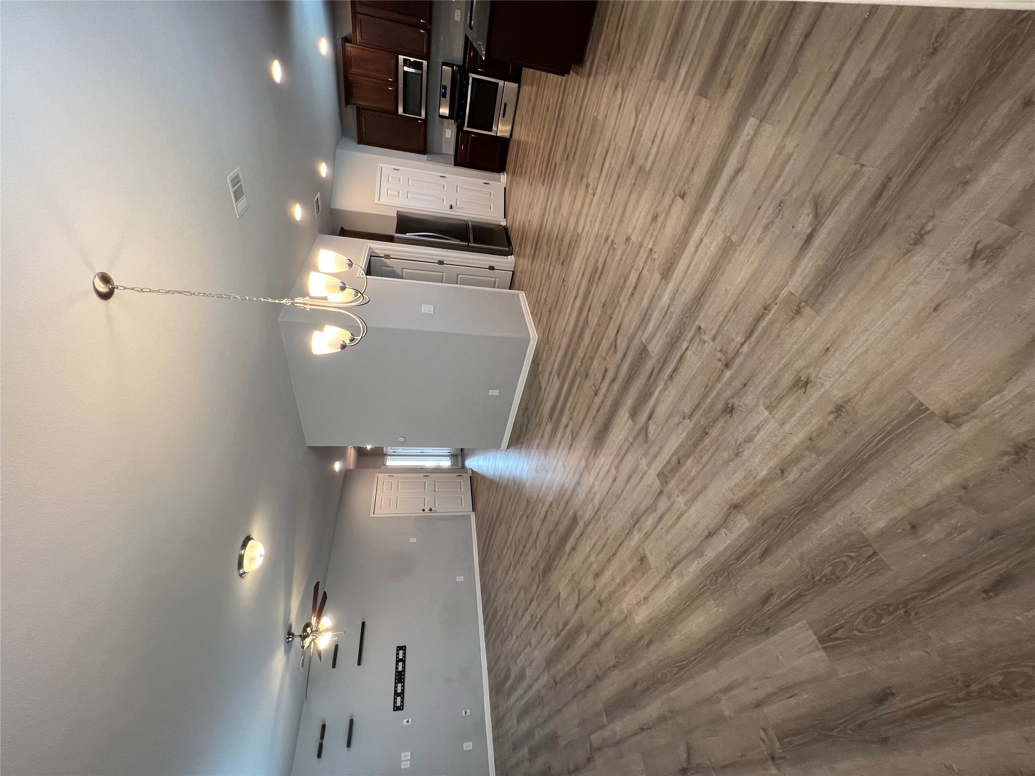 160 Shearwater Lane Leander, TX 78641 - Photo 5 of 24 a view of a room with stairs and a wooden floor