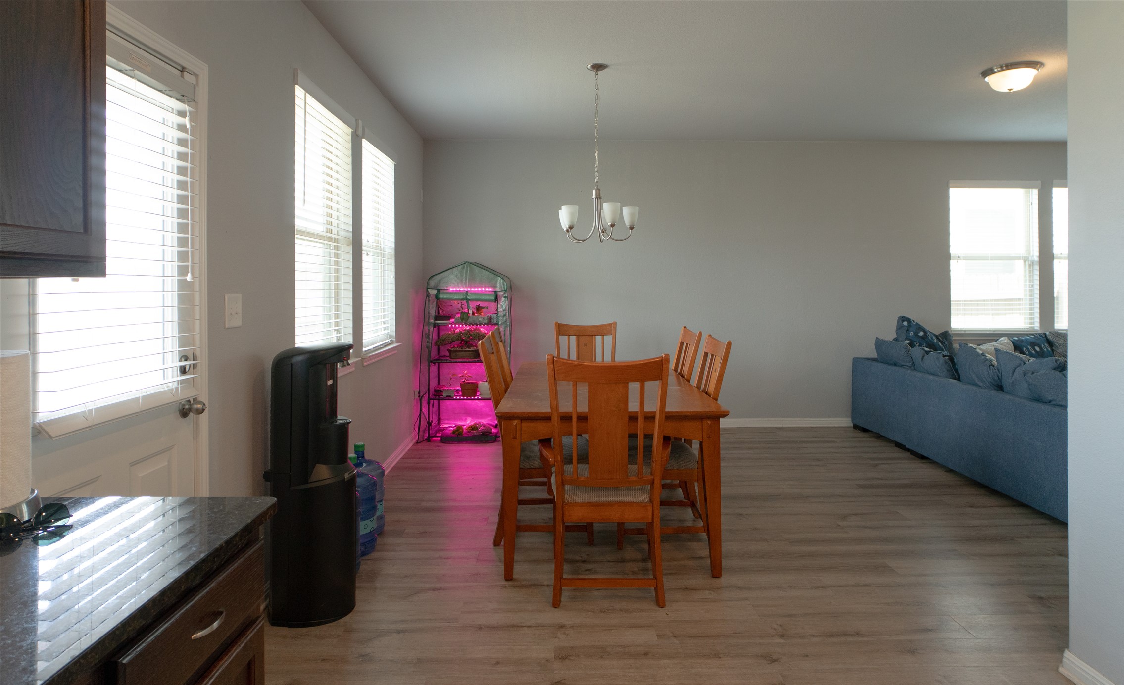 160 Shearwater Lane Leander, TX 78641 - Photo 9 of 24 a dining room with furniture and wooden floor