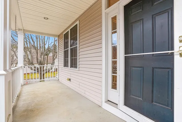a living room with furniture fireplace and a large mirror