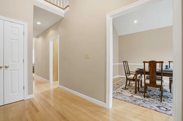 a kitchen with stainless steel appliances granite countertop a stove top oven a sink dishwasher a microwave oven and a granite counter tops with white cabinets