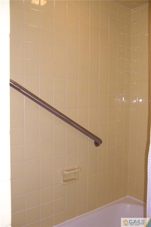 65 East Cliff Road Colonia, NJ 07067 - Photo 15 of 25 a bathroom with a shower