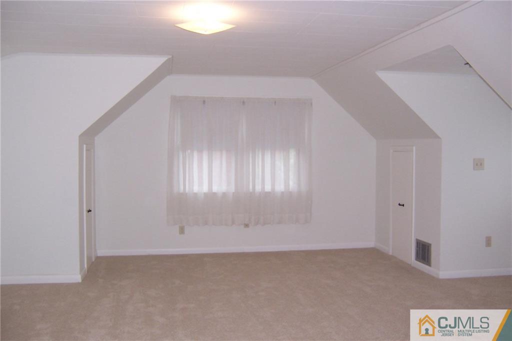 65 East Cliff Road Colonia, NJ 07067 - Photo 17 of 25 an empty room with windows