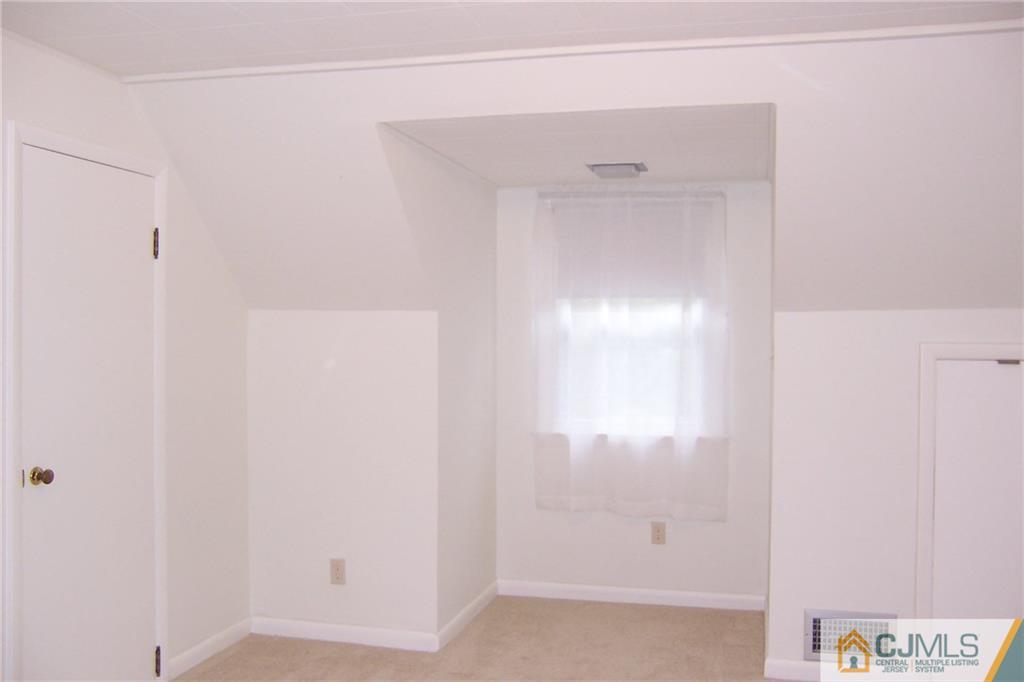 65 East Cliff Road Colonia, NJ 07067 - Photo 18 of 25 a bathroom with a shower
