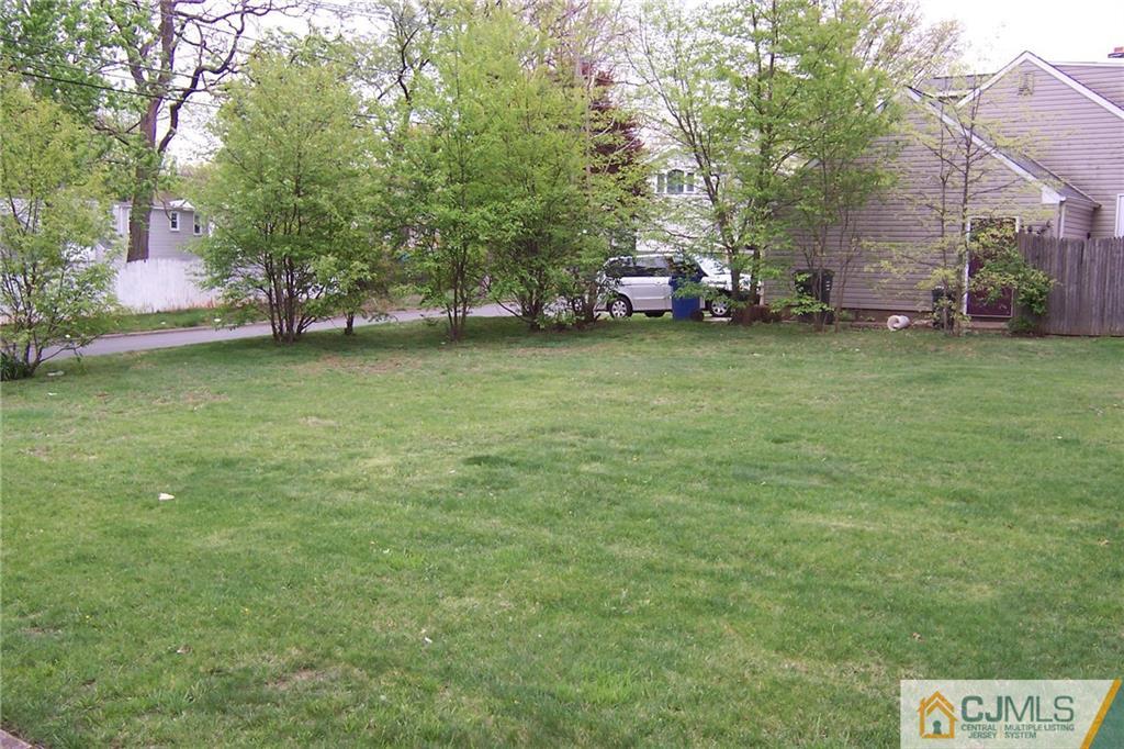 65 East Cliff Road Colonia, NJ 07067 - Photo 23 of 25 a backyard of a house with lots of green space