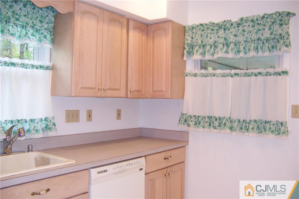 65 East Cliff Road Colonia, NJ 07067 - Photo 4 of 25 a kitchen with a sink and cabinets