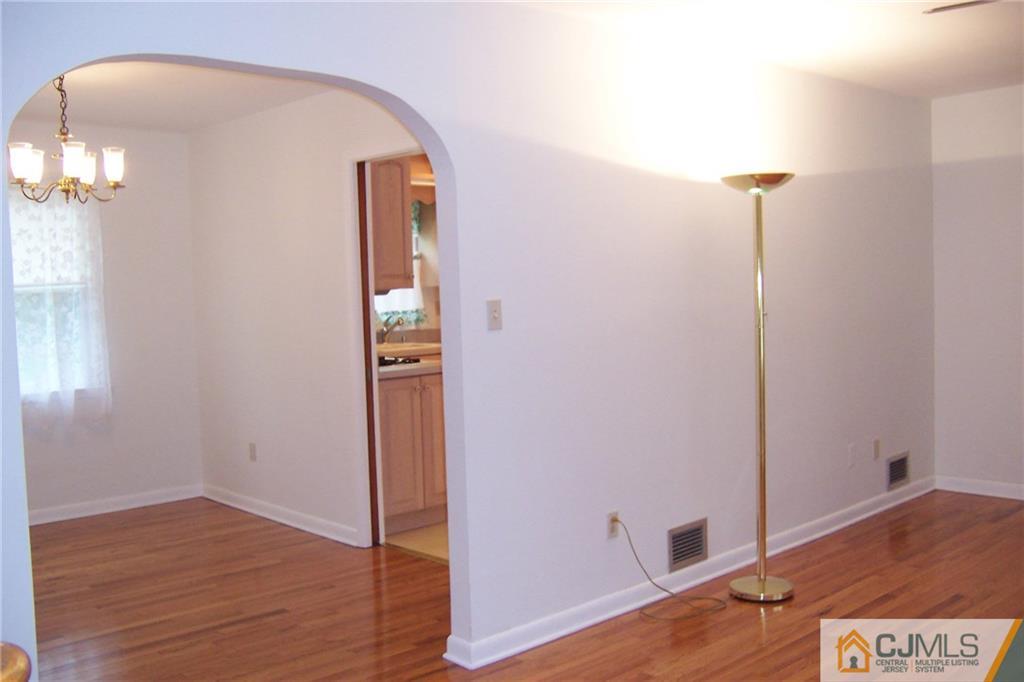 65 East Cliff Road Colonia, NJ 07067 - Photo 8 of 25 wooden floor in an empty room
