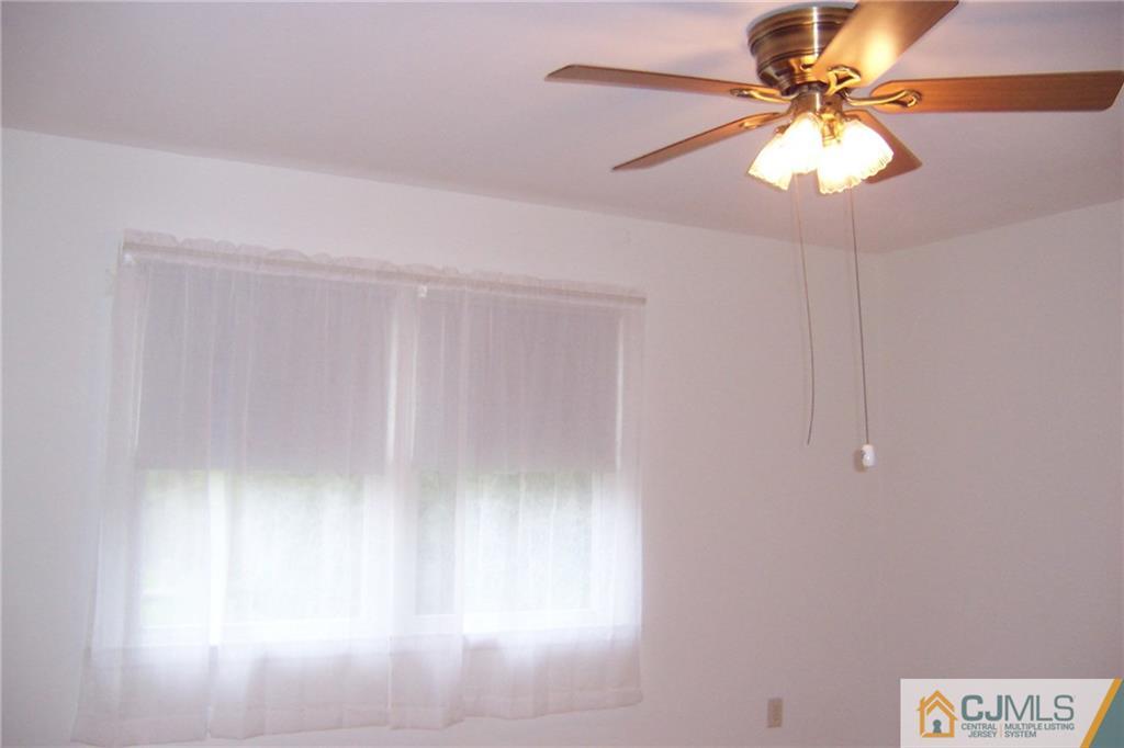 65 East Cliff Road Colonia, NJ 07067 - Photo 10 of 25 a window in an empty room