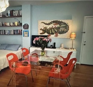 a dining room with furniture and wooden floor