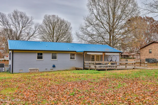 a view of a patio with wooden floor