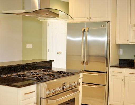 2 Conifer Hill Road Chelmsford, MA 01824 - Photo 12 of 32 a stove top oven sitting inside of a kitchen
