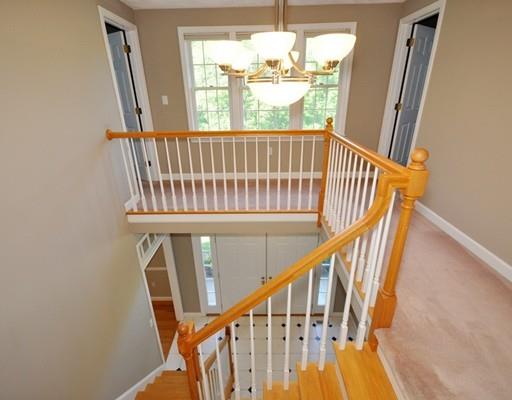 2 Conifer Hill Road Chelmsford, MA 01824 - Photo 17 of 32 a view of entryway with wooden floor and stairs