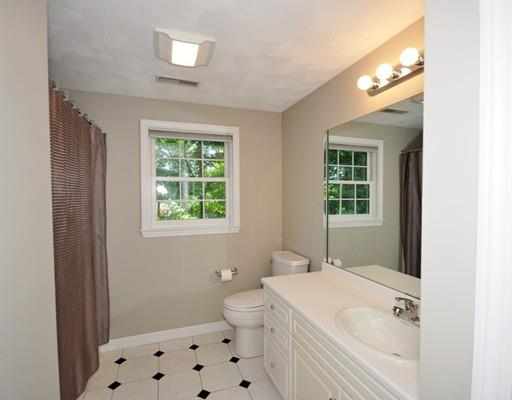 2 Conifer Hill Road Chelmsford, MA 01824 - Photo 19 of 32 a bathroom with a sink a toilet and a window