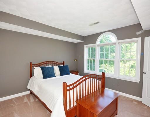 2 Conifer Hill Road Chelmsford, MA 01824 - Photo 25 of 32 a bedroom with a bed and a large window