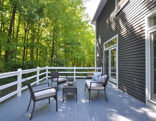 2 Conifer Hill Road Chelmsford, MA 01824 - Photo 29 of 32 a view of a chairs and table in the back yard of the house