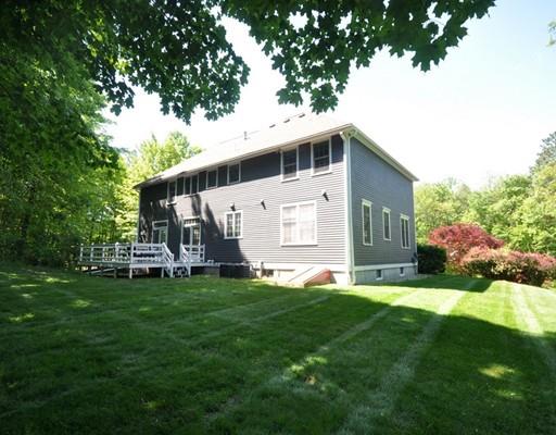 2 Conifer Hill Road Chelmsford, MA 01824 - Photo 30 of 32 a front view of a house with a yard and trees