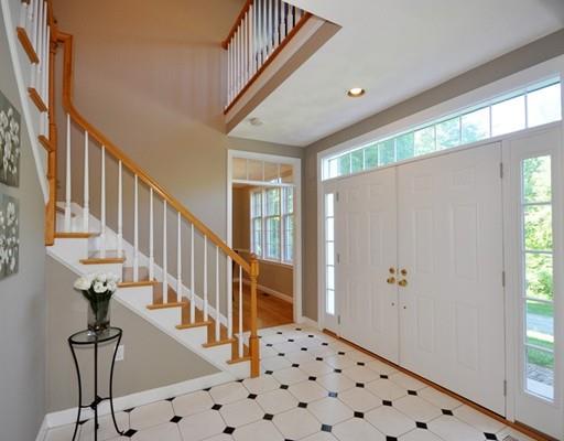 2 Conifer Hill Road Chelmsford, MA 01824 - Photo 3 of 32 a view of staircase with lots of frames on wall and a window
