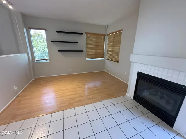 a view of empty room with windows