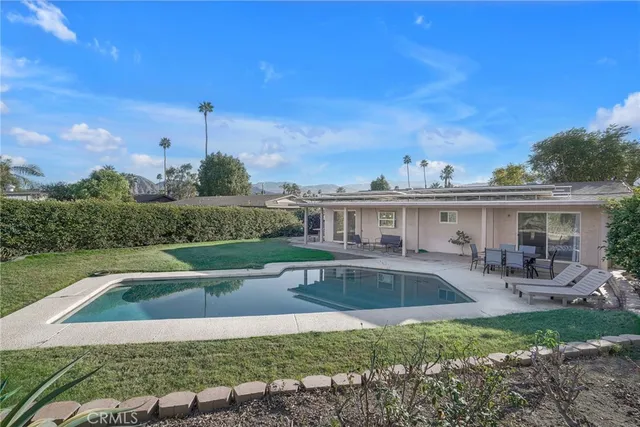 a view of a swimming pool with a patio