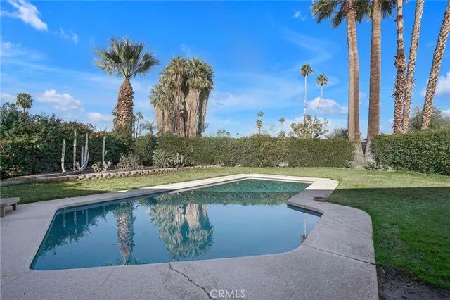 a view of swimming pool from a lake view