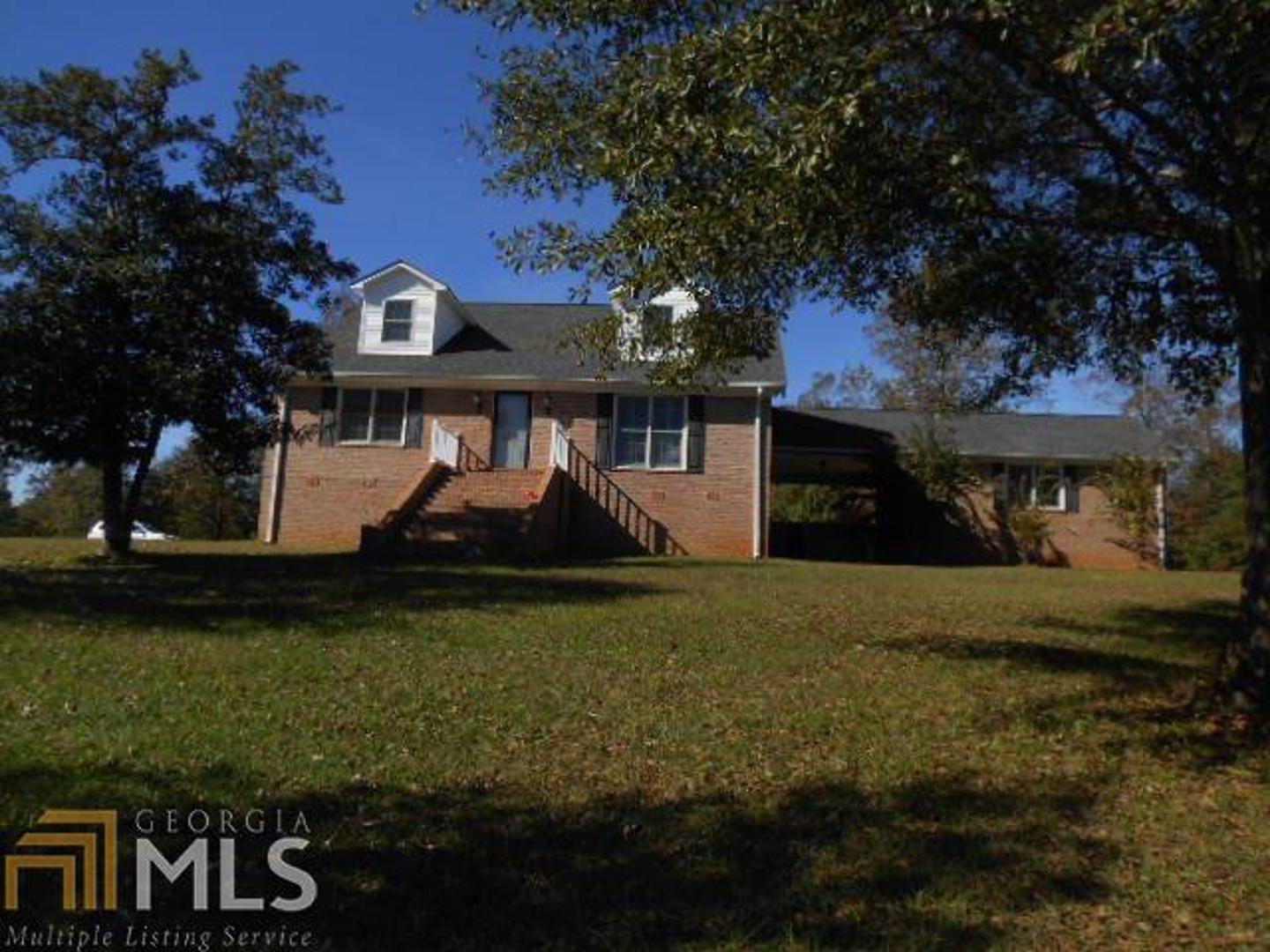2274 Oconee Church Road Dublin, GA 31021 - Photo 1 of 1 a front view of a house with garden