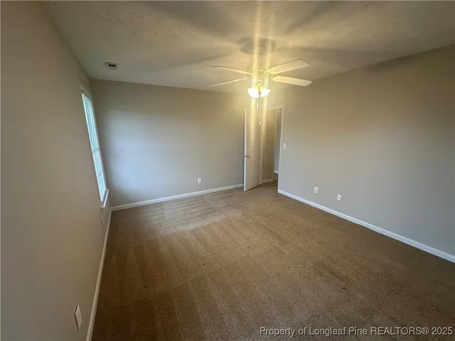 a bathroom with a double vanity sink mirror and toilet