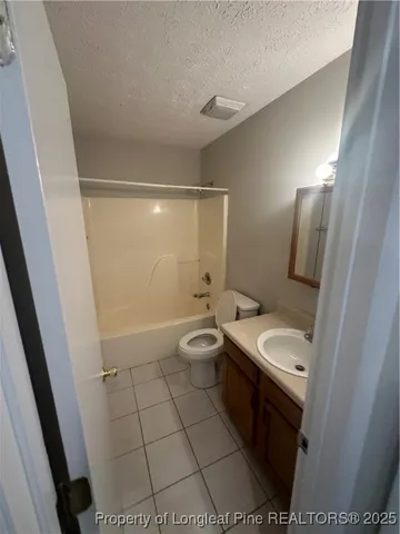 a bathroom with a sink toilet and a mirror