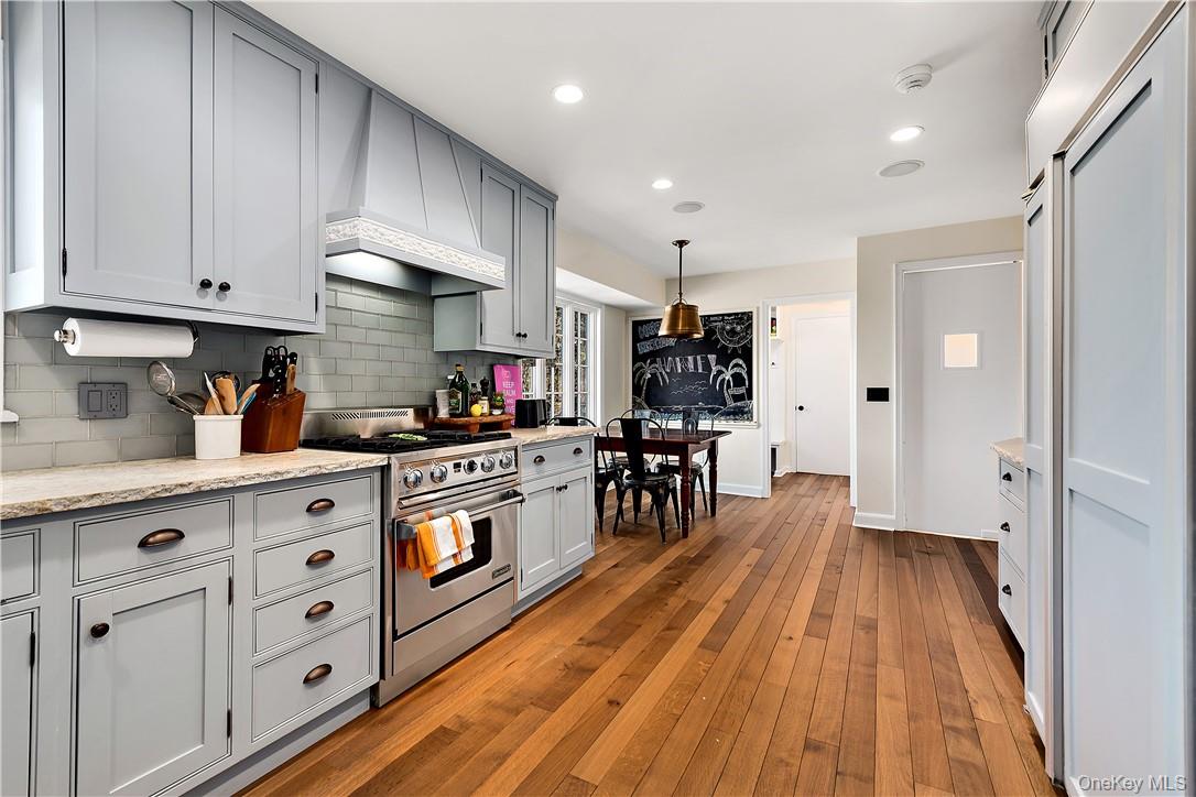 106 Old Stone Hill Road Pound Ridge, NY 10576 - Photo 13 of 25 a kitchen with stainless steel appliances a refrigerator sink and cabinets