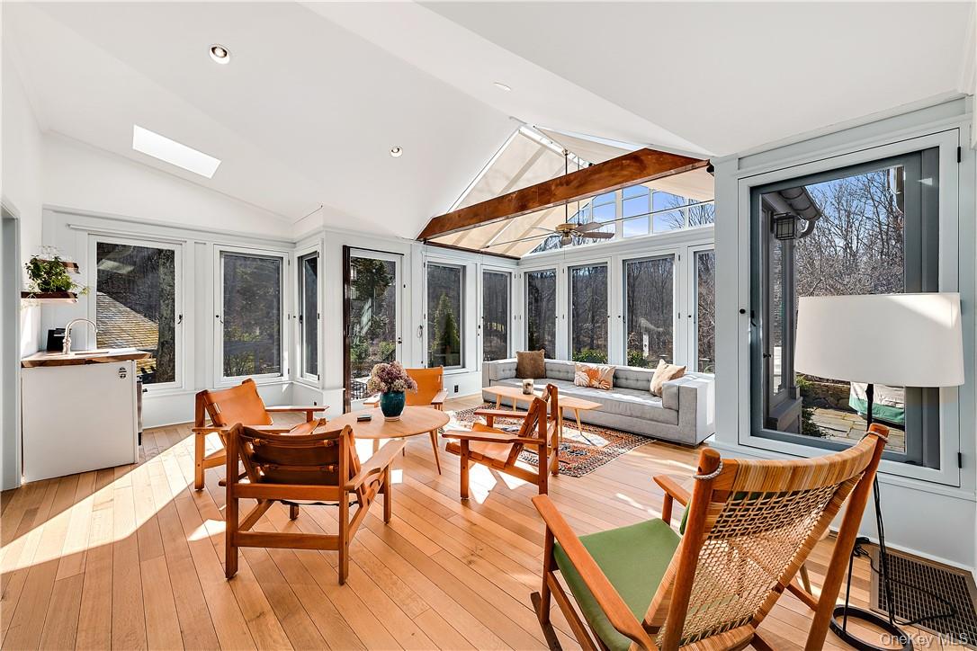 106 Old Stone Hill Road Pound Ridge, NY 10576 - Photo 7 of 25 a living room with patio furniture and a large window