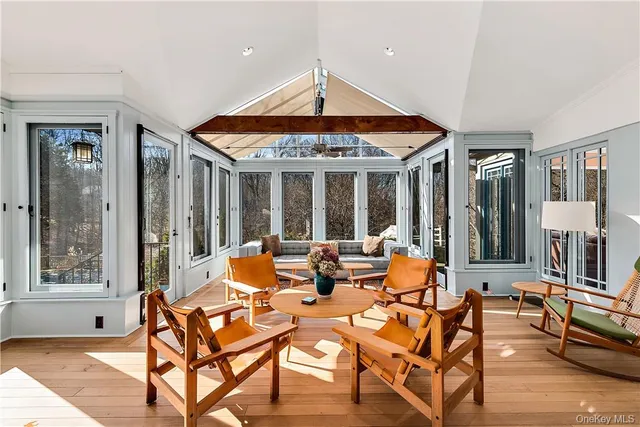 a outdoor space with patio the couches and a dining table with chairs