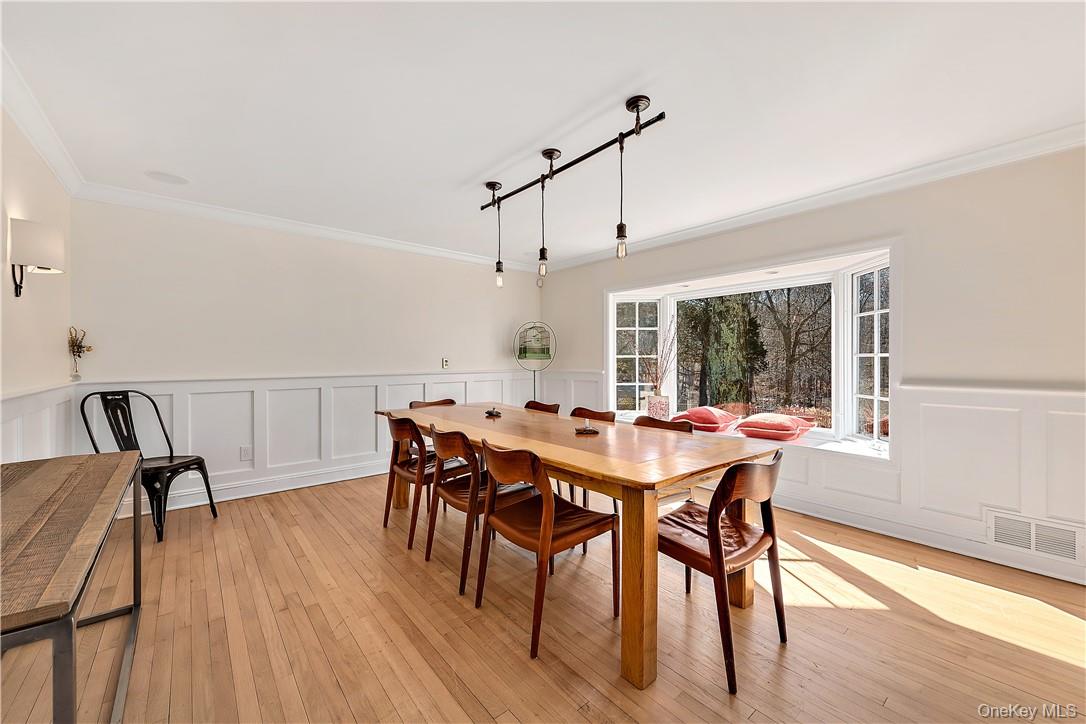 106 Old Stone Hill Road Pound Ridge, NY 10576 - Photo 10 of 25 a view of a dining room with furniture window and wooden floor