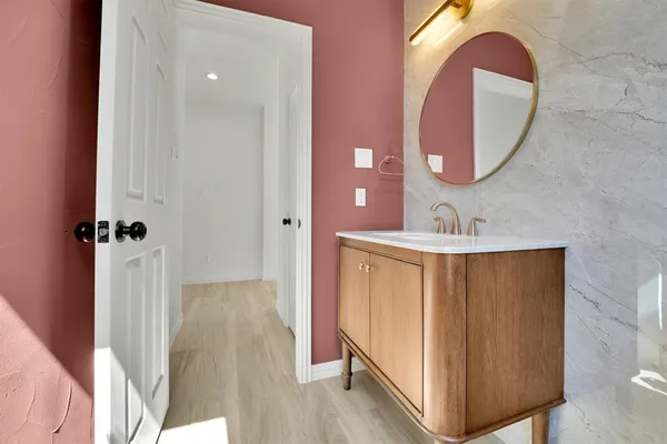 a bathroom with a sink and a mirror