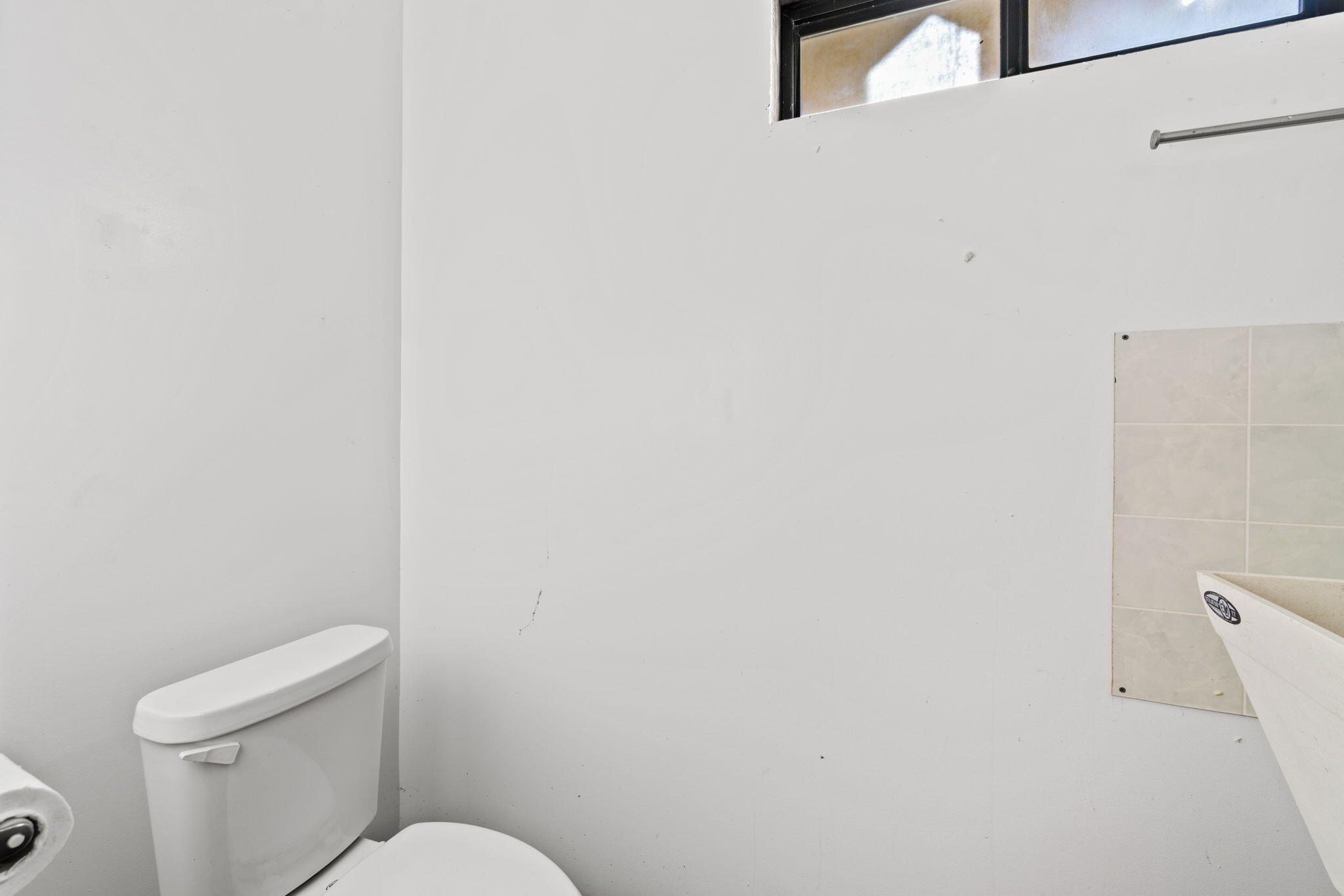 61 Kingston Road Fieldbrook, CA 95519 - Photo 37 of 48 a white toilet sitting next to a white wall