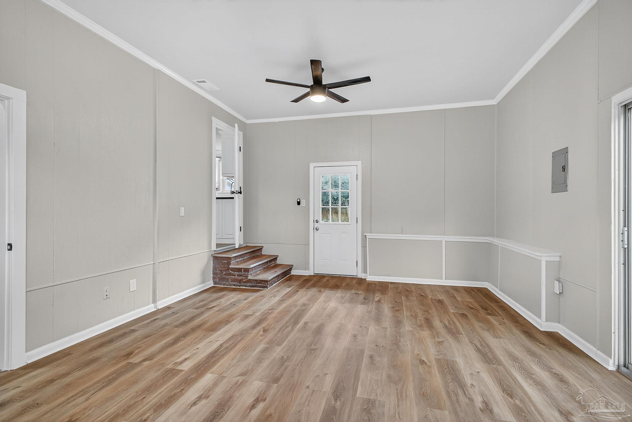 4673 Van Horn Road Milton, FL 32583 - Photo 26 of 53 a view of empty room with wooden floor and fan