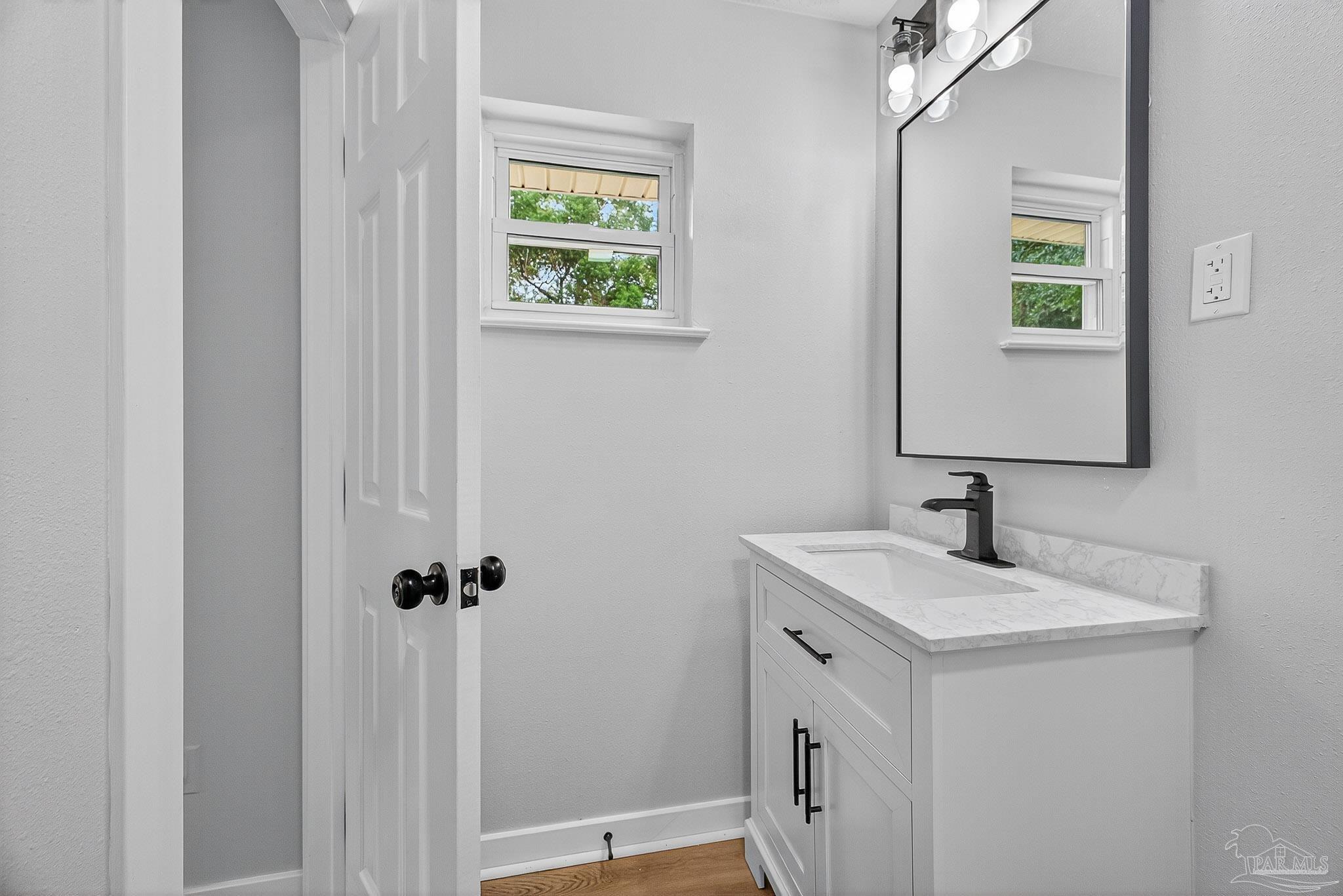 4673 Van Horn Road Milton, FL 32583 - Photo 45 of 53 a bathroom with a sink and a mirror